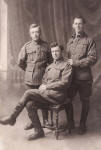 Ned Wells (seated) with two comrades